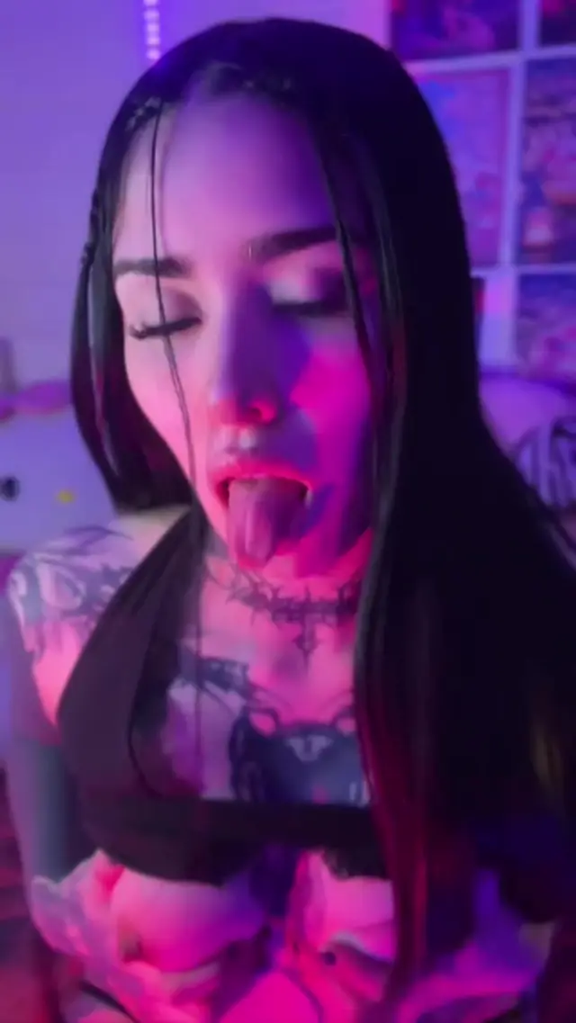 Goth babe shows off natural tits and nipples